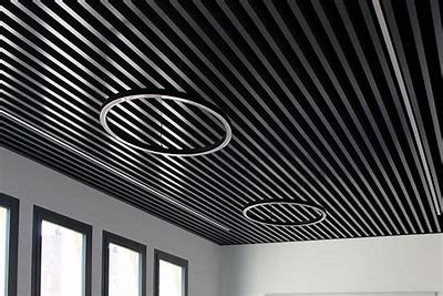 Metal ceiling grid being installed in a modern office space